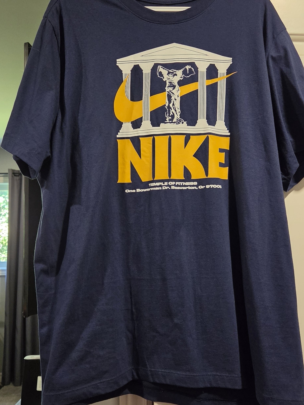 Nike Navy Short Sleeve Tee with Yellow Logo Temple Graphic